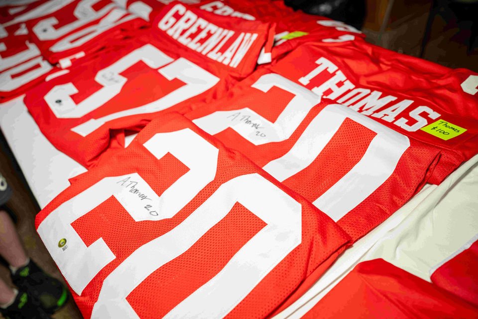 49ers gear displayed at a fan event